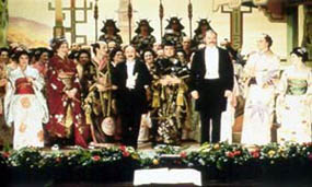 Sullivan (left) and Gilbert (right) accept the adulation of the crowd on the opening night of The Mikado.
