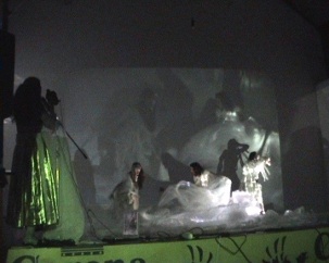 The final Beachcombers installation/performance, Beachcombers in the Heart of Athens, Athens Video Arts Festival, 2009. Performers dance and recite ancient and modern Greek, Jonathan Levine plays live his violin composition and Vagh’s direct filming merges with her three videos on multiple screens.